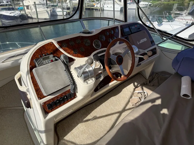 Slide: The Image of Interior view of a 1999 Maxum 4100 SCA helm station. - 23