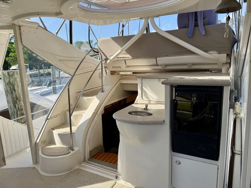 Slide: The Image of Interior of a 1999 Maxum 4100 SCA yacht with stairs and sink. - 24