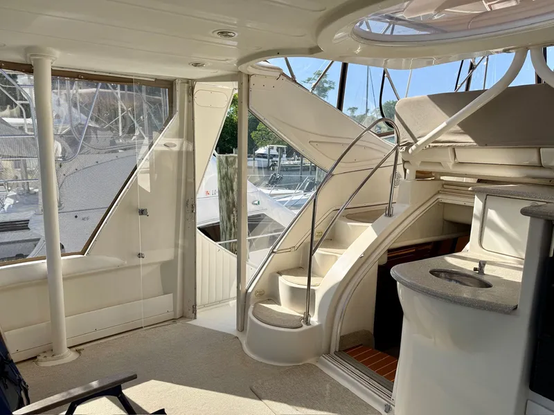 Slide: The Image of Interior of a 1999 Maxum 4100 SCA yacht with stairs and windows. - 25