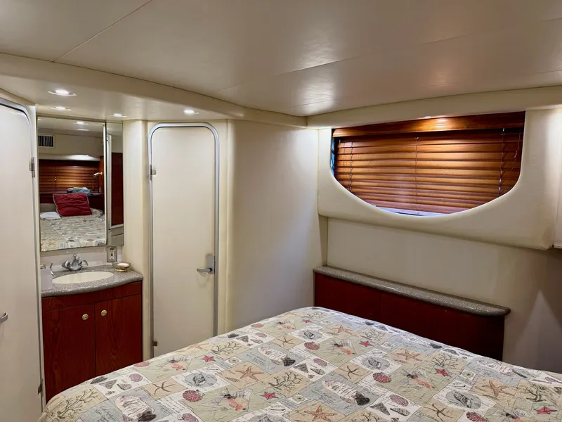 Slide: The Image of 1999 Maxum 4100 SCA yacht interior with cozy bedroom. - 5