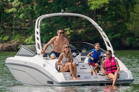 Slide: The Image of 2026 Yamaha Boats 195S with family enjoying a sunny day on the water. - 16
