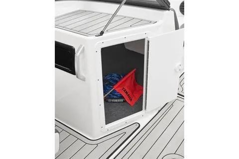 Slide: The Image of 2026 Yamaha Boats 195S storage compartment with safety equipment and accessories. - 6