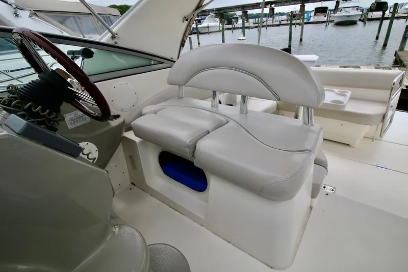 Slide: The Image of 2009 Larson Cabrio 310 boat interior with helm seat and steering wheel. - 12