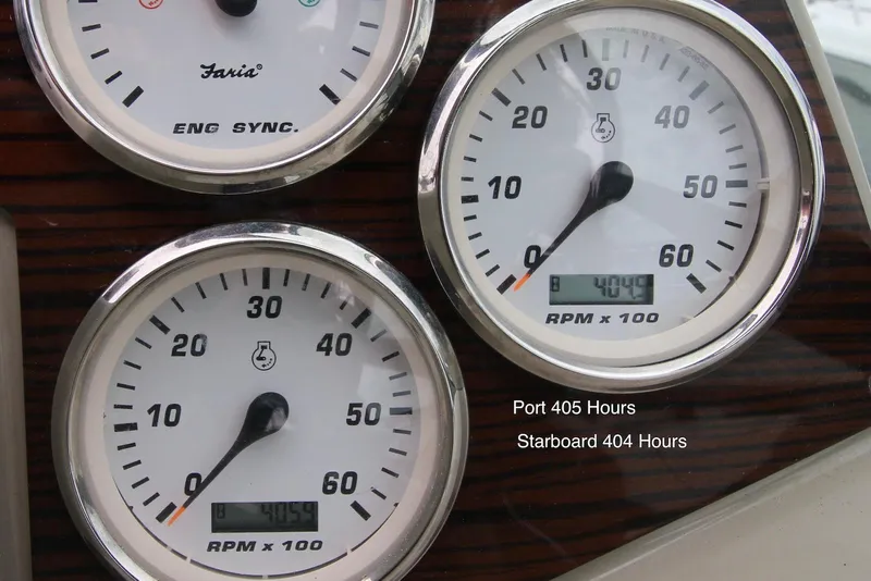 Slide: The Image of Close-up of Larson Cabrio 310 2009 boat gauges showing RPM and engine hours. - 18