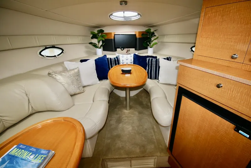 Slide: The Image of Luxurious interior of a 2009 Larson Cabrio 310 yacht with plush seating and elegant decor. - 20
