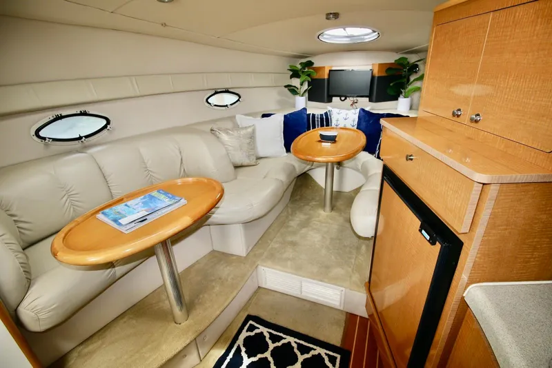Slide: The Image of Luxurious interior of 2009 Larson Cabrio 310 yacht with plush seating and elegant decor. - 21