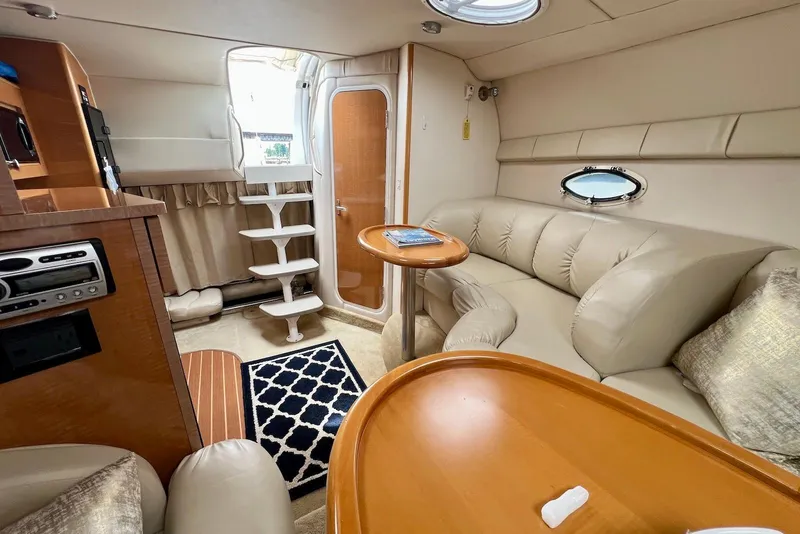 Slide: The Image of Luxurious interior of a 2009 Larson Cabrio 310 yacht with plush seating and elegant decor. - 32