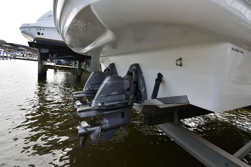 Slide: The Image of Rear view of a 2009 Larson Cabrio 310 boat in water. - 6