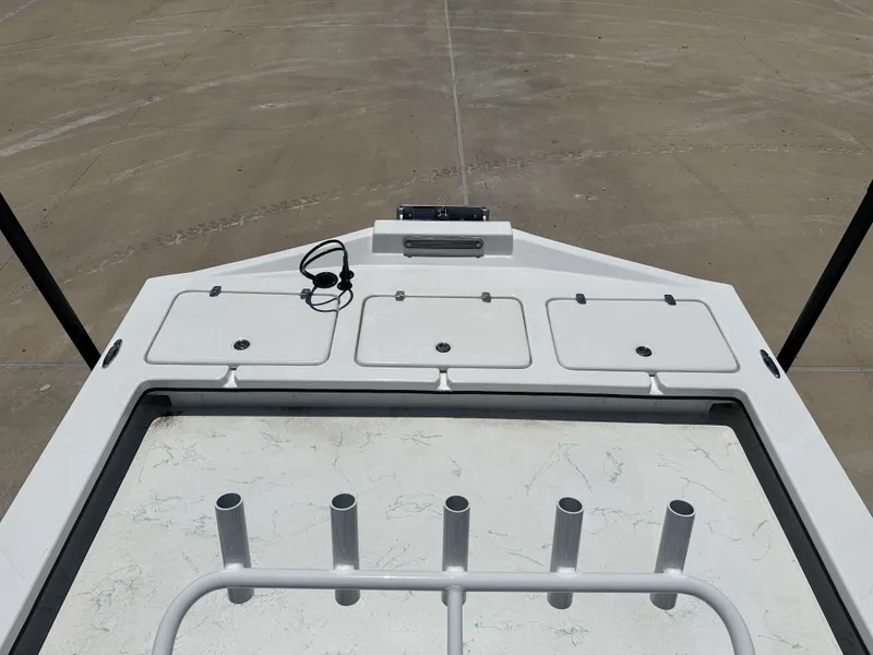 Slide: The Image of Deck of a 2026 Shoalwater 23' Catamaran with storage compartments. - 17