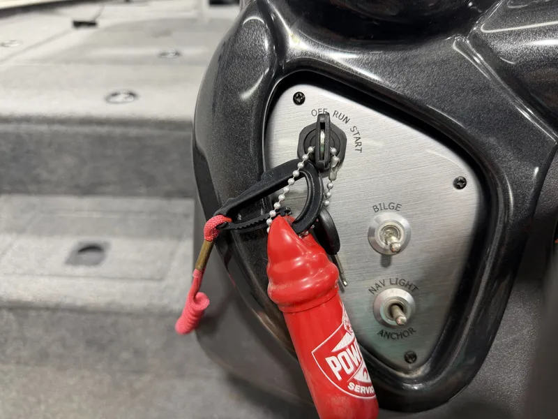 Slide: The Image of 2019 Tracker Pro Team 195 TXW boat controls with switches. - 20