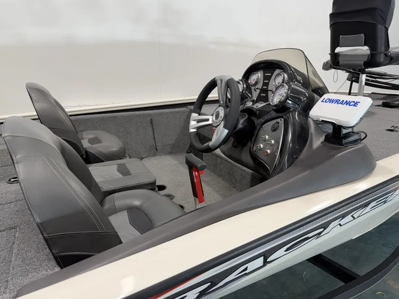 Slide: The Image of Interior of a 2019 Tracker Pro Team 195 TXW boat with steering console. - 9