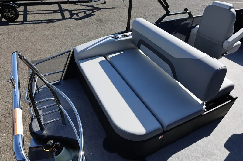 Slide: The Image of 2026 Lowe SS 230 CL boat interior with gray seating and stainless steel railing. - 16
