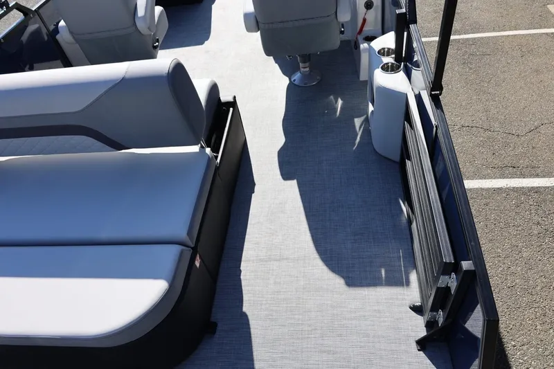 Slide: The Image of Interior view of 2026 Lowe SS 230 CL pontoon boat with seating and flooring. - 17