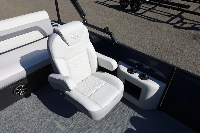 Slide: The Image of Luxurious seating on 2026 Lowe SS 230 CL boat with cup holders and stylish design. - 23