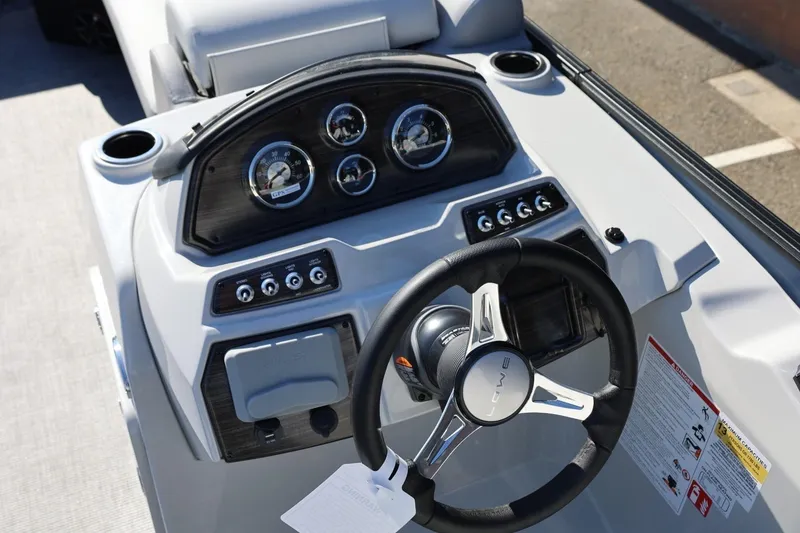 Slide: The Image of Steering console of 2026 Lowe SS 230 CL boat with gauges and controls. - 26