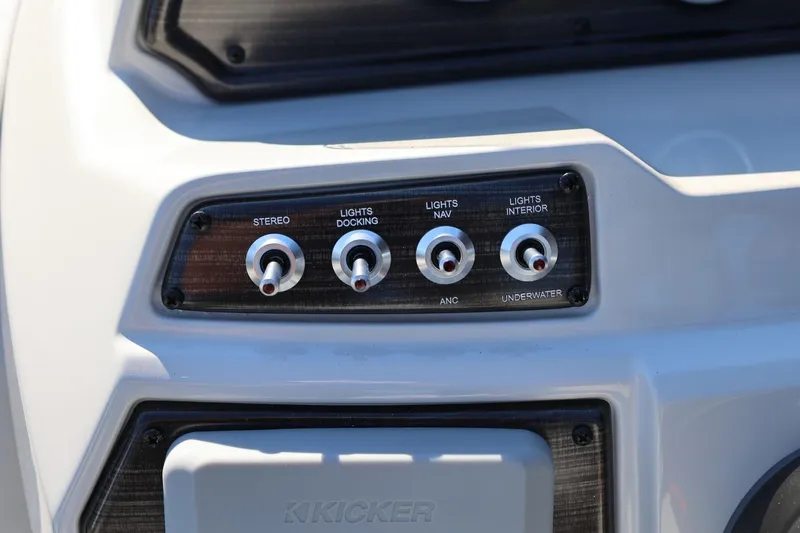 Slide: The Image of Control panel of 2026 Lowe SS 230 CL boat with switches for stereo and lights. - 27