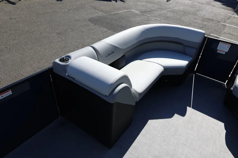 Slide: The Image of 2026 Lowe SS 230 CL pontoon boat with gray seating and cup holder. - 36