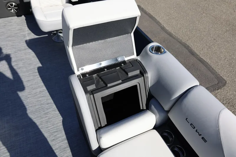 Slide: The Image of Open storage compartment on 2026 Lowe SS 230 CL boat with cup holder. - 37