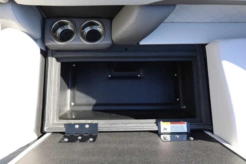 Slide: The Image of Interior storage compartment of 2026 Lowe SS 230 CL boat with cup holders. - 38