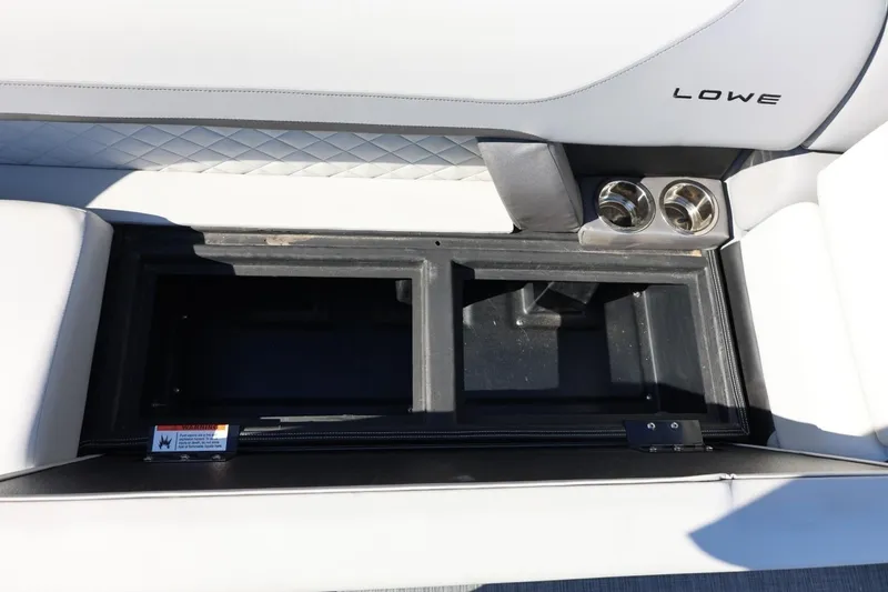 Slide: The Image of Interior storage compartment of 2026 Lowe SS 230 CL boat with cup holders. - 41