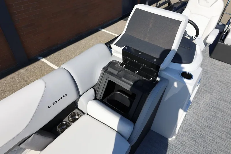 Slide: The Image of 2026 Lowe SS 230 CL boat interior with seating and storage compartment. - 42