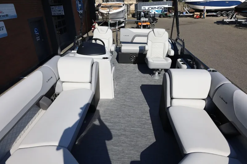 Slide: The Image of 2026 Lowe SS 230 CL pontoon boat with spacious seating and modern design. - 43