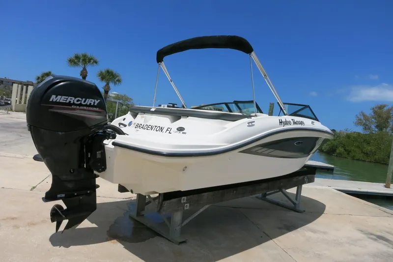 Slide: The Image of 2017 Sea Ray SPX 190 Outboard boat with Mercury engine on a sunny dock. - 1