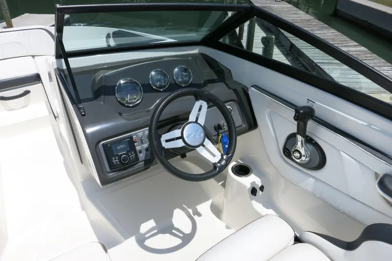 Slide: The Image of 2017 Sea Ray SPX 190 Outboard boat dashboard with steering wheel and controls. - 10
