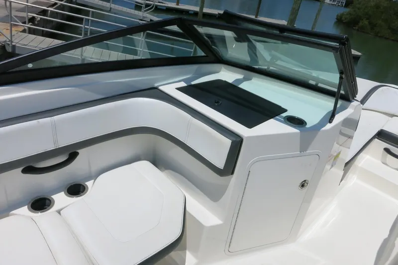 Slide: The Image of 2017 Sea Ray SPX 190 Outboard boat interior with seating and storage compartments. - 11