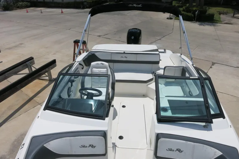 Slide: The Image of 2017 Sea Ray SPX 190 Outboard boat with open cockpit and seating, parked on concrete. - 13
