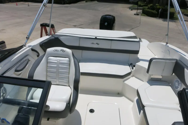 Slide: The Image of 2017 Sea Ray SPX 190 Outboard boat interior with seating and steering wheel. - 17