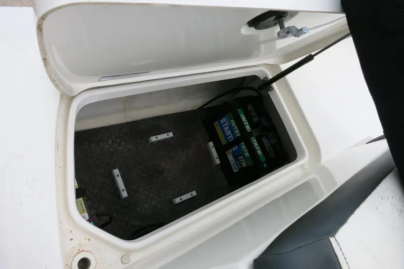 Slide: The Image of 2017 Sea Ray SPX 190 Outboard battery compartment with Interstate batteries visible. - 31