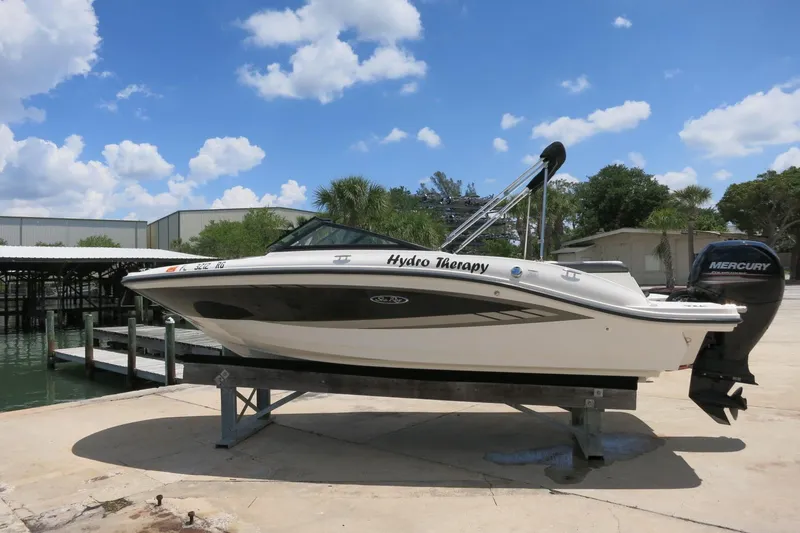 Slide: The Image of 2017 Sea Ray SPX 190 Outboard boat on a lift, clear sky background. - 4