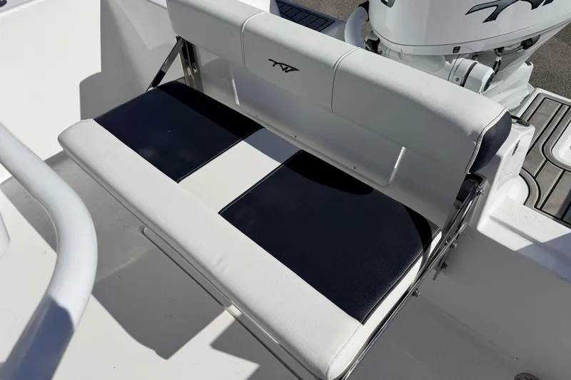 Slide: The Image of 2026 Tidewater 210 CC Adventure boat seat with black and white upholstery. - 12