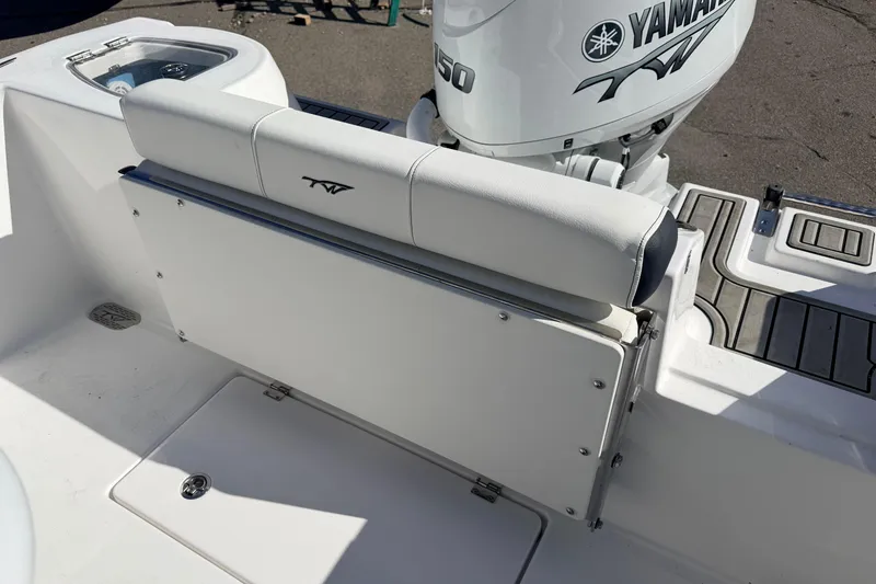 Slide: The Image of 2026 Tidewater 210 CC Adventure boat with Yamaha 150 engine, featuring a foldable seat. - 13