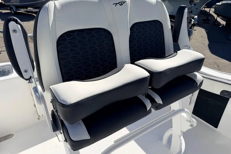 Slide: The Image of 2026 Tidewater 210 CC Adventure boat seats with black and white upholstery. - 14