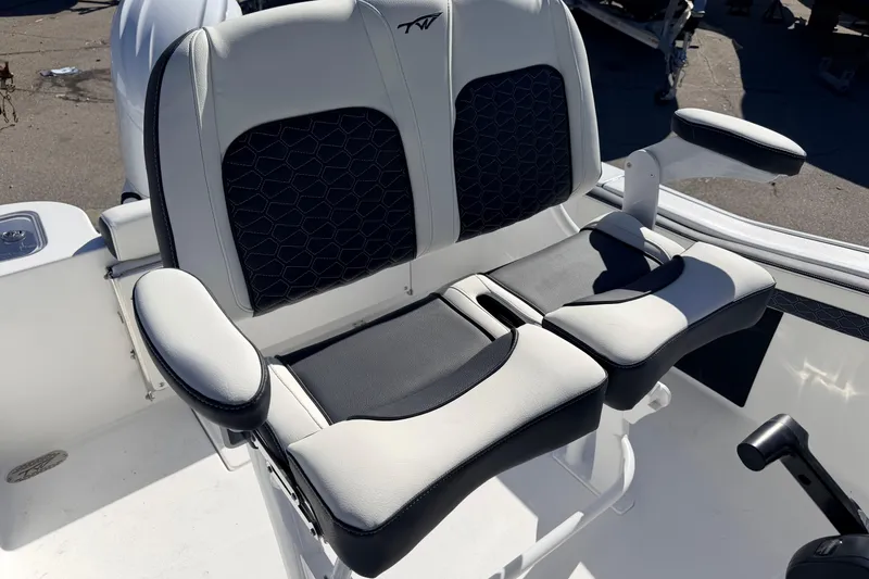 Slide: The Image of 2026 Tidewater 210 CC Adventure boat seating with cushioned armrests and stylish design. - 15