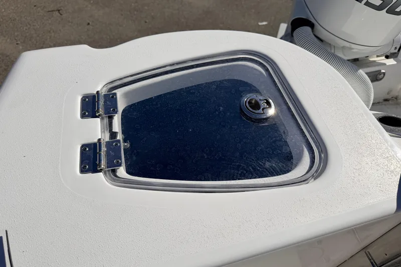 Slide: The Image of Hinged compartment on 2026 Tidewater 210 CC Adventure boat deck. - 16