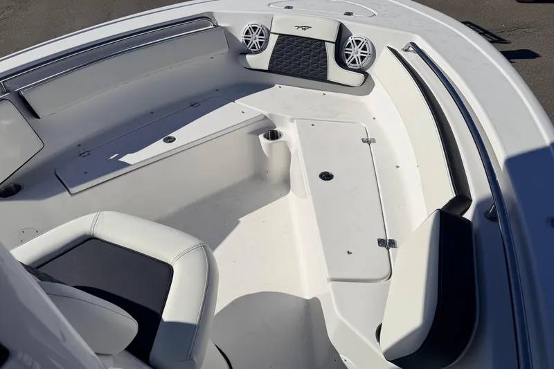 Slide: The Image of 2026 Tidewater 210 CC Adventure boat interior with seating and storage compartments. - 18