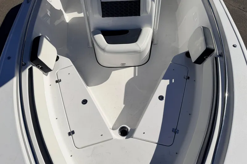 Slide: The Image of 2026 Tidewater 210 CC Adventure boat interior with seating and storage compartments. - 19
