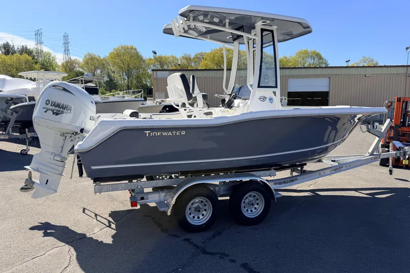 Slide: The Image of 2026 Tidewater 210 CC Adventure boat on trailer with Yamaha engine in outdoor setting. - 2