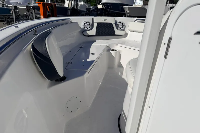 Slide: The Image of 2026 Tidewater 210 CC Adventure boat interior with seating and speakers. - 21