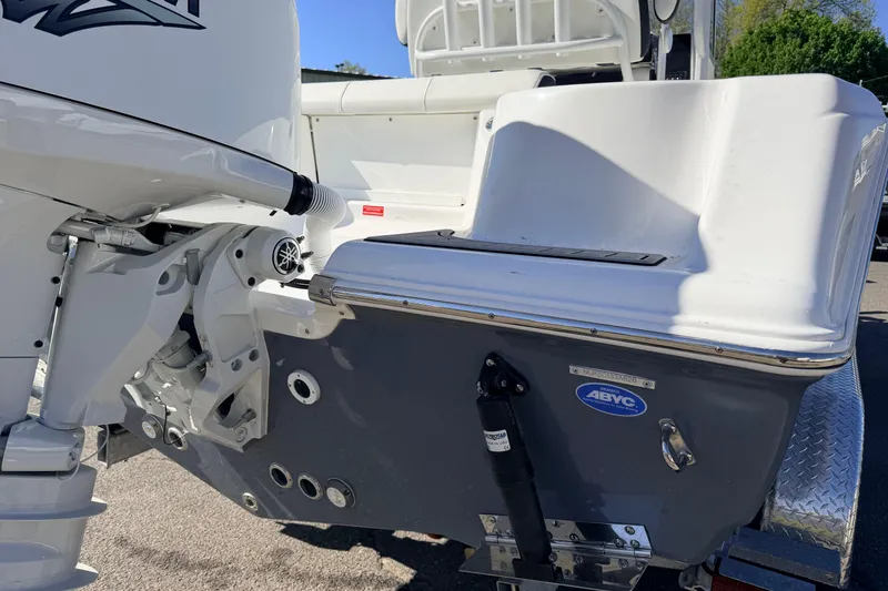Slide: The Image of 2026 Tidewater 210 CC Adventure boat's rear view with motor and trailer details. - 4