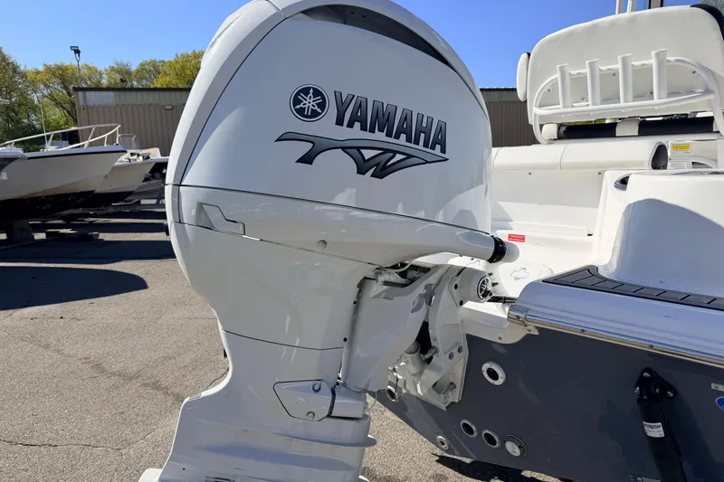 Slide: The Image of 2026 Tidewater 210 CC Adventure boat with Yamaha outboard motor in a marina setting. - 7