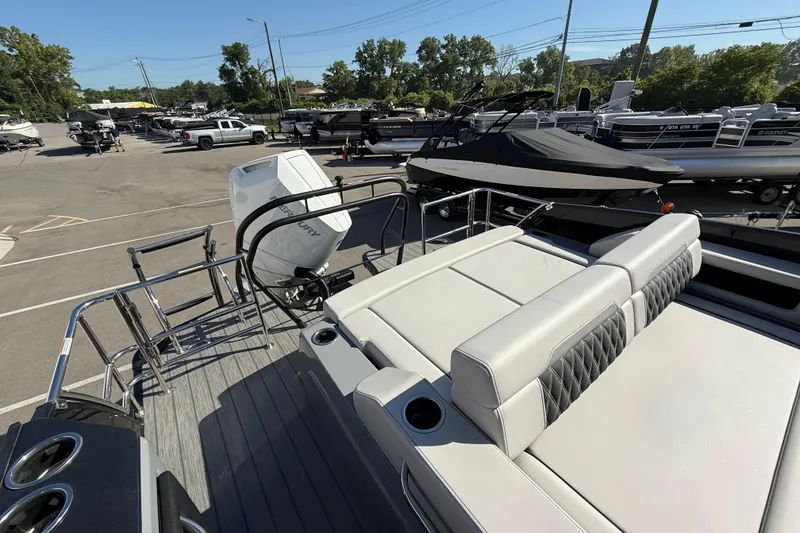 Slide: The Image of 2024 Godfrey Sanpan 2500 DFLW pontoon boat with luxurious seating and powerful outboard motor. - 15