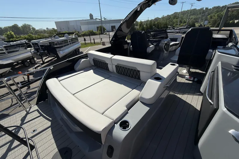 Slide: The Image of 2024 Godfrey Sanpan 2500 DFLW pontoon boat interior with luxurious seating and modern design. - 16