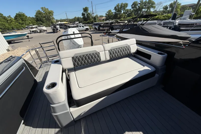 Slide: The Image of 2024 Godfrey Sanpan 2500 DFLW boat interior with luxurious seating and cup holders. - 17