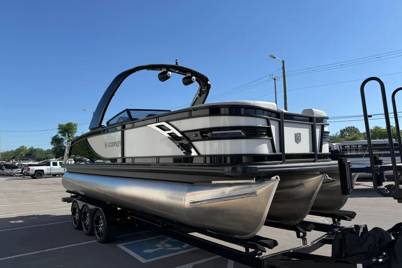 Slide: The Image of 2024 Godfrey Sanpan 2500 DFLW pontoon boat on trailer in parking lot. - 4