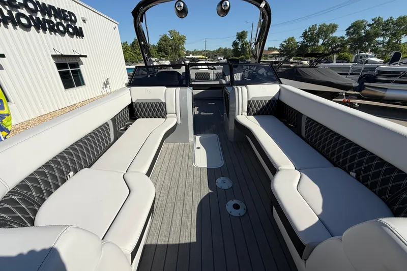 Slide: The Image of 2024 Godfrey Sanpan 2500 DFLW pontoon boat interior with luxurious seating and modern design. - 6