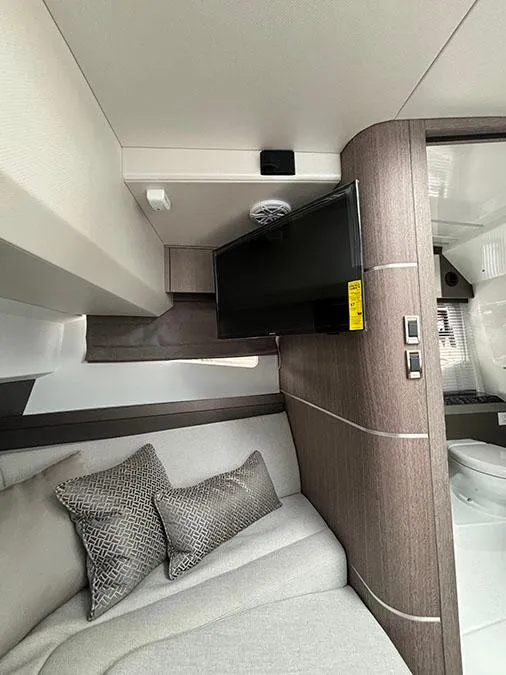 Slide: The Image of Interior cabin of 2024 Galeon 325 GTO with TV and seating area. - 22
